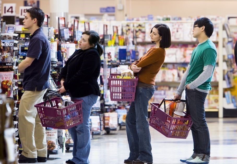 People are queuing in the supermarket